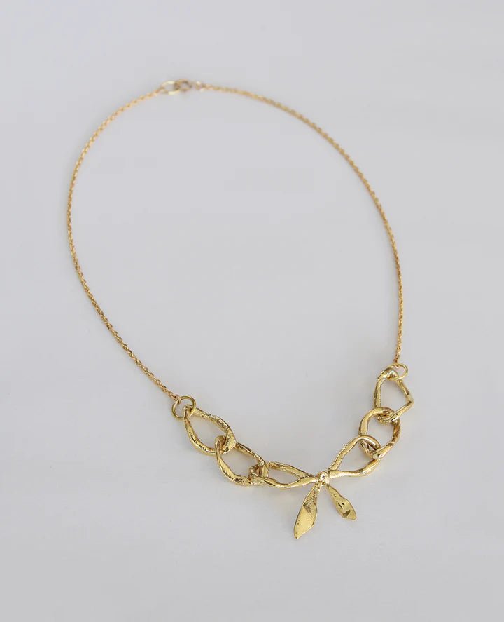 ORA - C Bow Realis Necklace (Brass) - Victoire BoutiqueORA - CNecklaces Ottawa Boutique Shopping Clothing